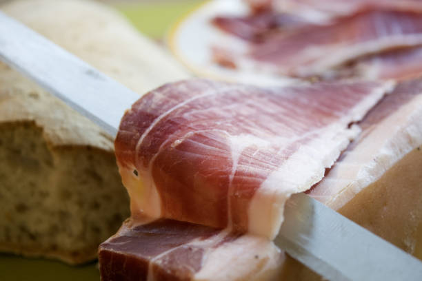 istock prosciutto di parma cut by hand 692243234