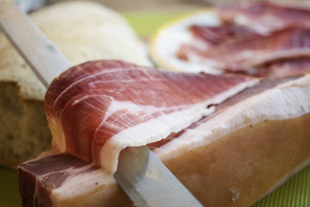 istock prosciutto di parma cut by hand 692243258