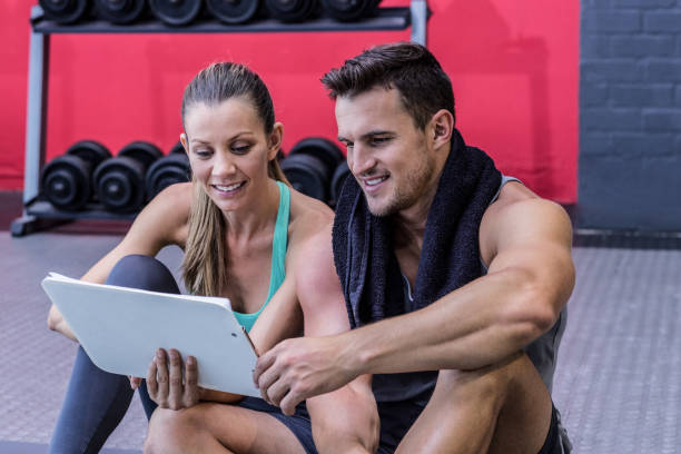 istock A female coach explaining directives with clipboard 692244768