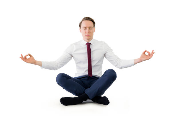 istock Zen businessman meditating in yoga pose 692253334