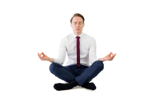 istock Zen businessman meditating in yoga pose 692253374