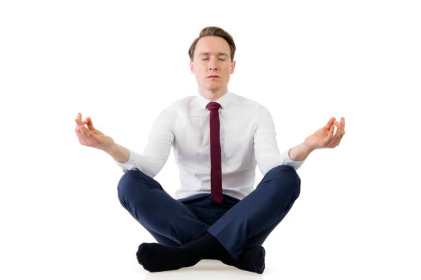 istock Zen businessman meditating in yoga pose 692253420
