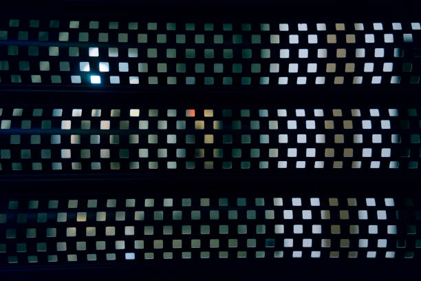 istock Dark Blue Metal Grating Light Dots On A Wall 692253484