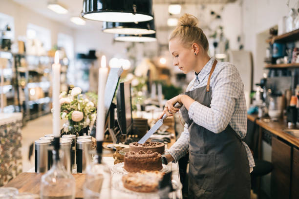 istock Woman Cutting Cake 692253560