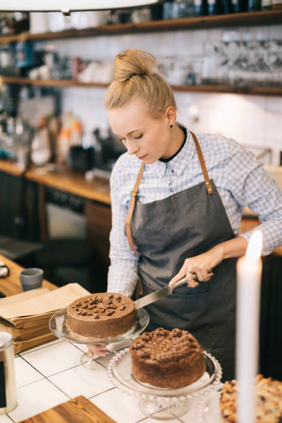 istock Woman Cutting Cake 692253578