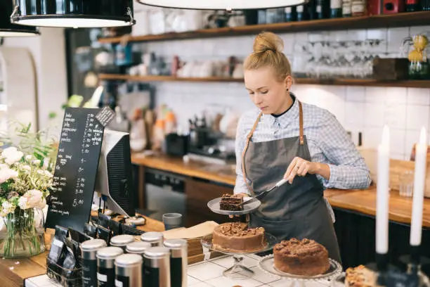 Photo of Woman Cutting Cake