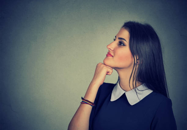 istock young woman thinking looking up 692253620