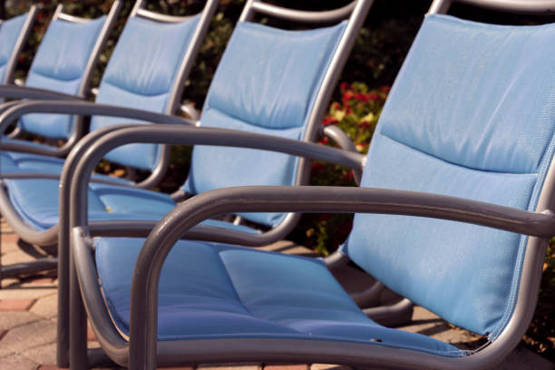 istock Blue Deck Chairs Near A Pool And Park 692253982