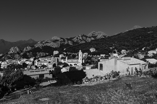 Black and white photo of a beautiful little town in Corsica, France.