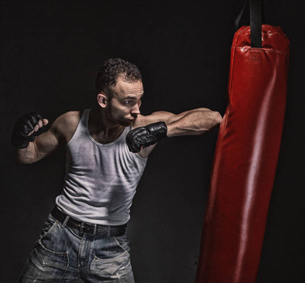 istock Boxing kick in the red punching pear 692257056