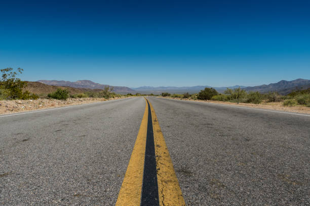 istock Low Angle View of Desert Road 692259908
