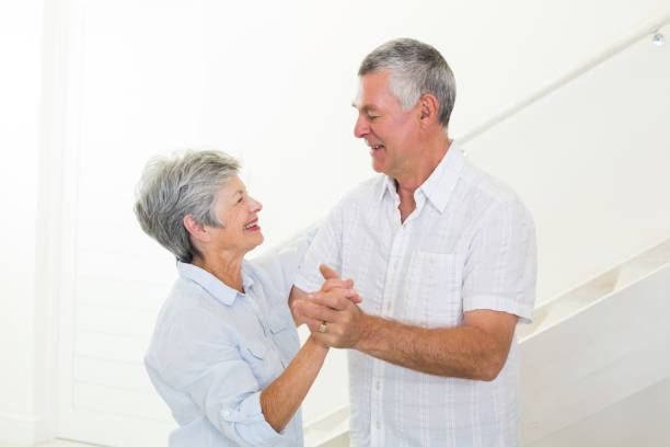 istock Cheerful senior couple dancing together 692260550