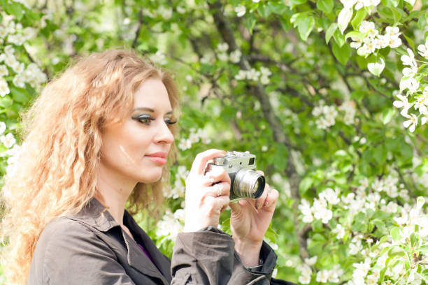 istock Woman and retro camera 692270530