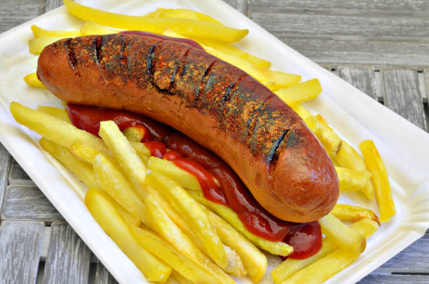 Grilled Sausage with French fries and Ketchup stock photo