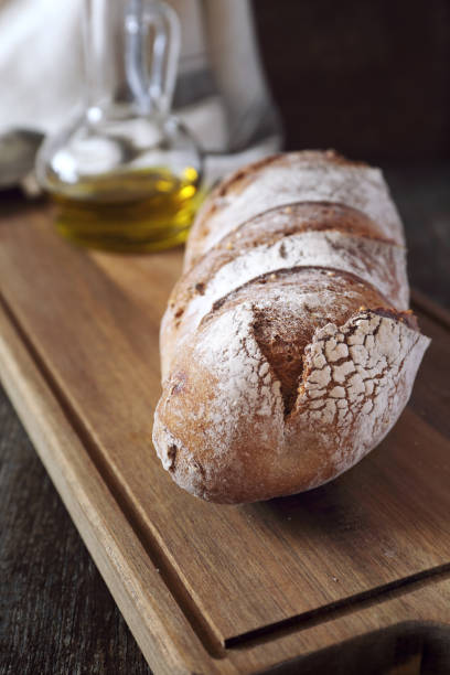 istock Country rye bread and olive oil 692276570