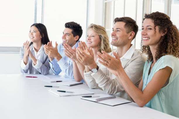 istock Casual business team clapping at presentation 692279972