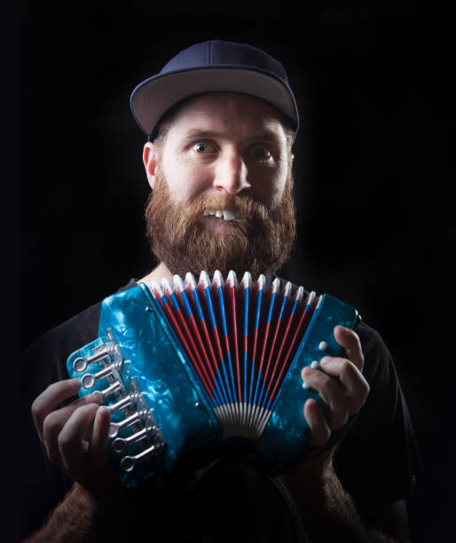 istock Funny man playing the accordion 692282566