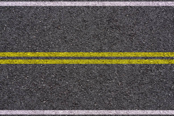 istock Road with white and yellow lines 692285614