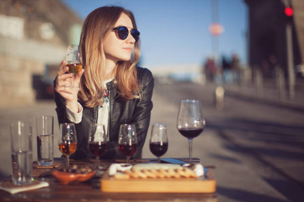 woman with wine testing glasses - vinho do porto imagens e fotografias de stock