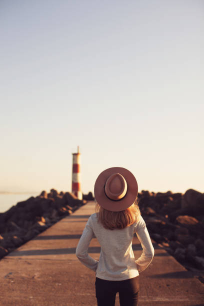 istock Young woman at lighthouse 692288934