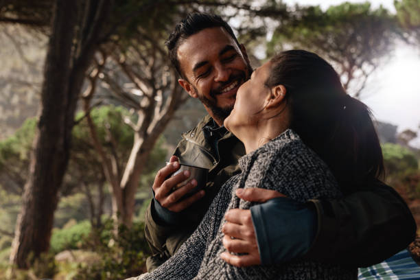 istock Loving couple camping in forest and having coffee 692292848