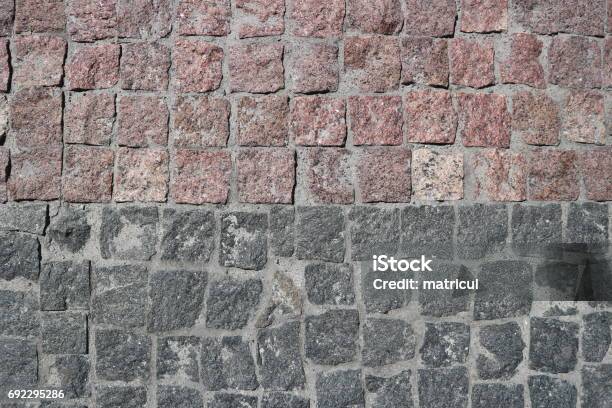 Rubble Gray And Brown Square Stones Paved Road With A Horizontal Border Stock Photo - Download Image Now