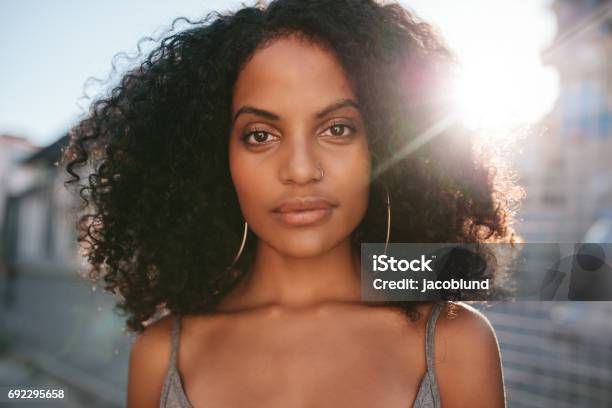 Afro American Female Standing Outdoors Stock Photo - Download Image Now - Women, One Woman Only, Human Face