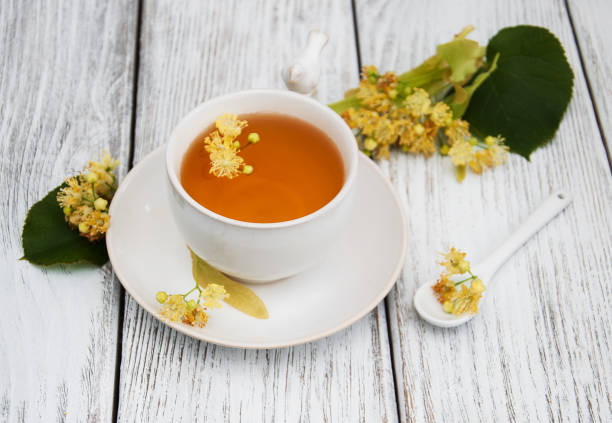 istock cup of herbal tea with linden flowers 692296320