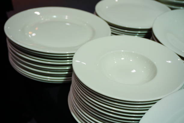 istock Several stacks of white porcelain plates 692306740