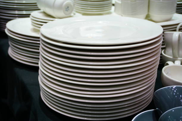 istock Several stacks of white porcelain plates 692306760