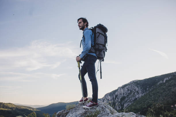 istock Handsome man hiking in the mountains 692309904