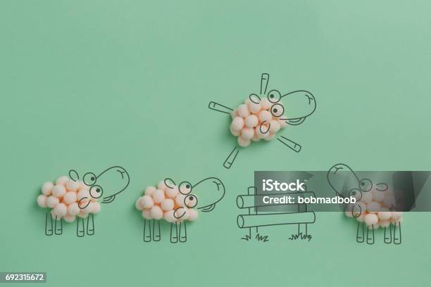 Sheep Jumping Over The Fence Stock Photo - Download Image Now - Sheep, Sleeping, Concepts