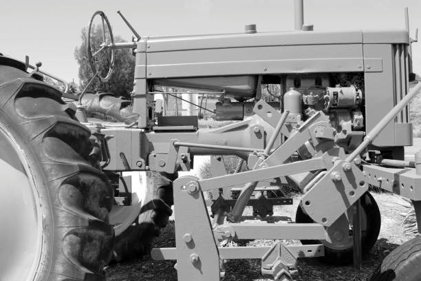 a tractor plowing a field to prepare for planting crops