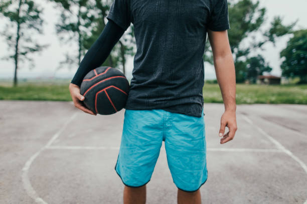 istock Man with basketball in hands 692328460