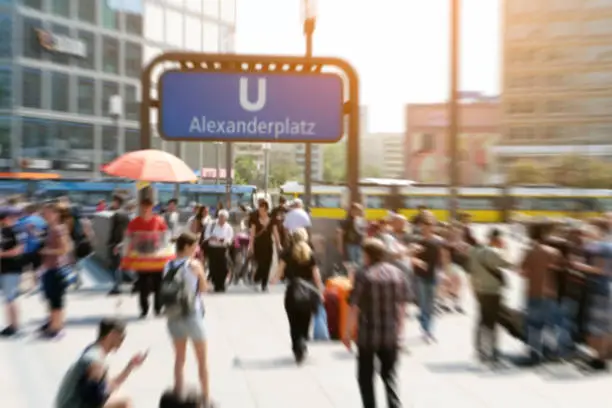 crowds of people in motion blur on Alexanderplatz in Berlin city