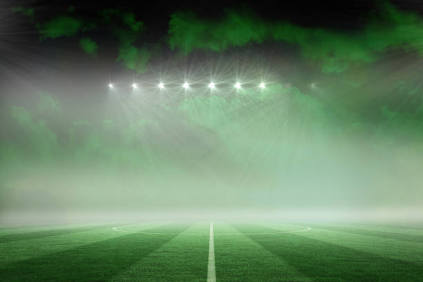 istock Football pitch under green sky 692354540