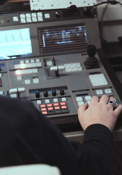 istock TV editor working with audio video mixer in a television broadcast 692354588