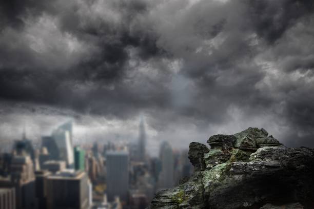 istock Large rock overlooking dark city 692354608