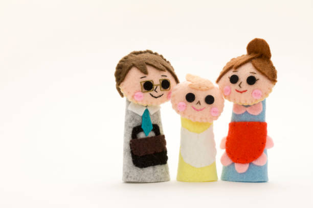 istock puppet of the couple and their infant 692354716