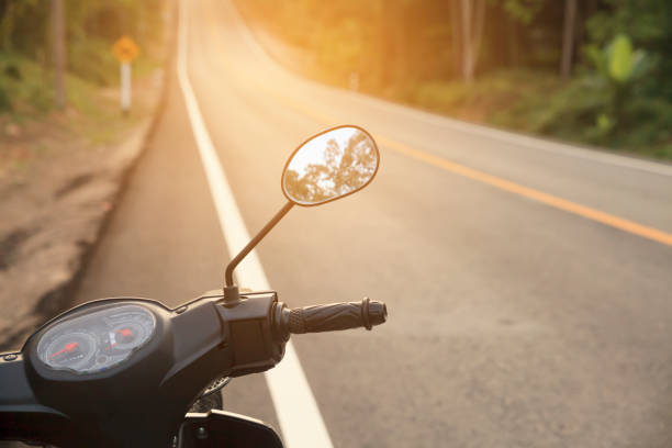 istock Handlebars of motorcycle on sunset. 692370808
