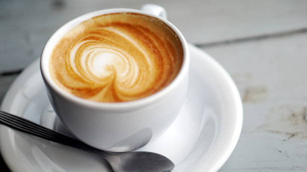 istock Latte art and cappuccino coffee with flowers made from milk 692379094