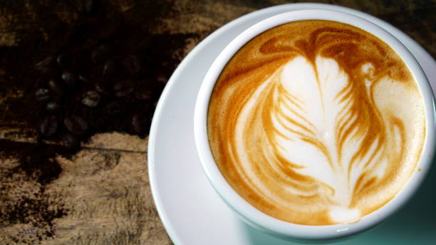 istock Latte art and cappuccino coffee with flowers made from milk 692381440