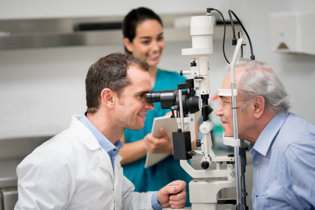 istock Senior patient getting an eye exam at the optician 692381668