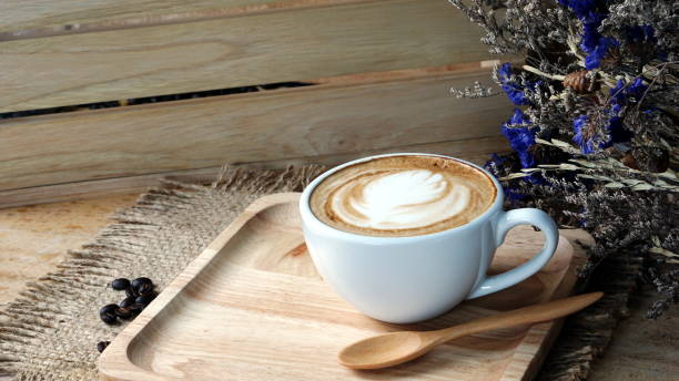 istock Latte art and cappuccino coffee with flowers made from milk 692384794