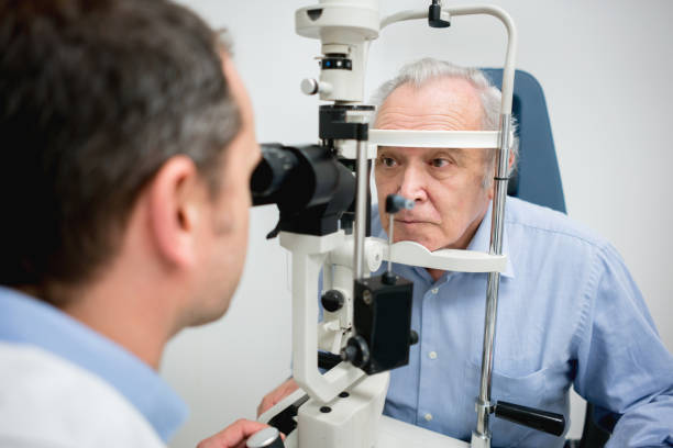 istock Senior patient getting an eye exam at the optician 692385126