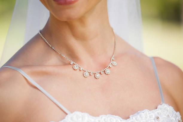 istock Mid section of a beautiful bride wearing a necklace 692387476