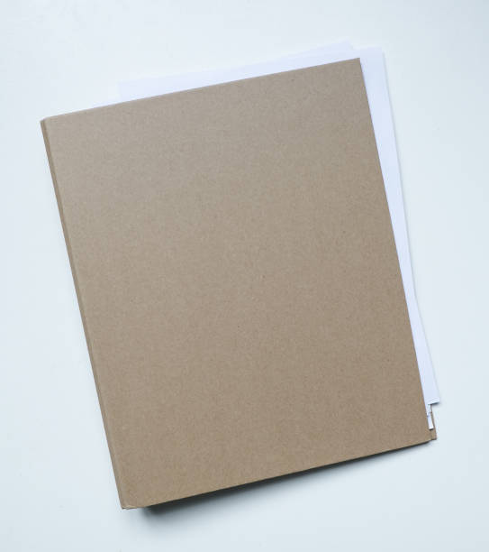istock Blank brown card folder file with paper showing isolated on white background. 692387754