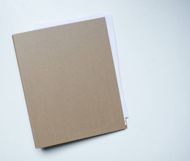 istock Blank brown card folder file with paper showing isolated on white background. 692387856