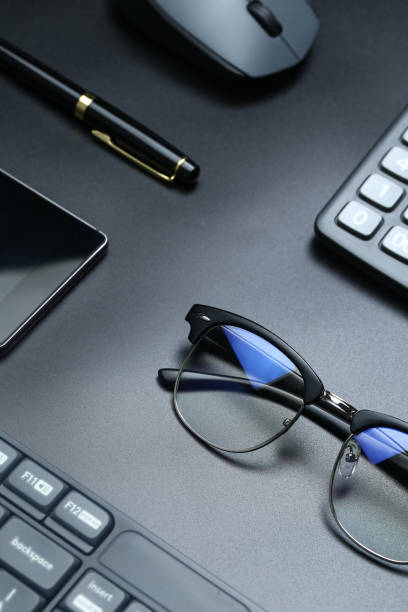 istock black office business equipment on black background 692390568