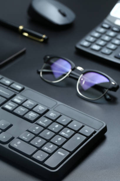 istock black office business equipment on black background 692390694